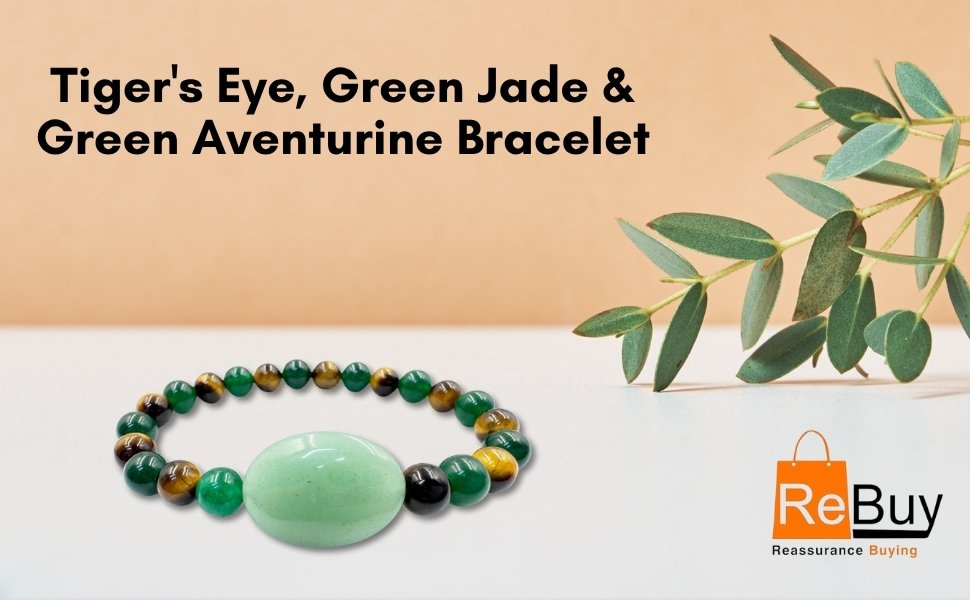 The Tiger's Eye, Green Jade and Green Aventurine bracelet presented neatly next to a eucalyptus branch