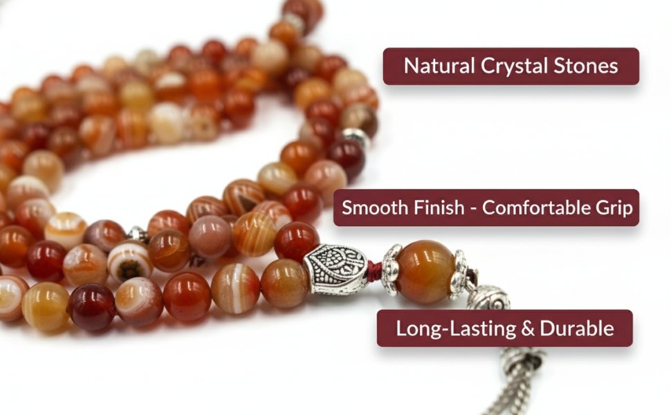 Macro detail close up of smooth finish red agate beads and silver metal detailing