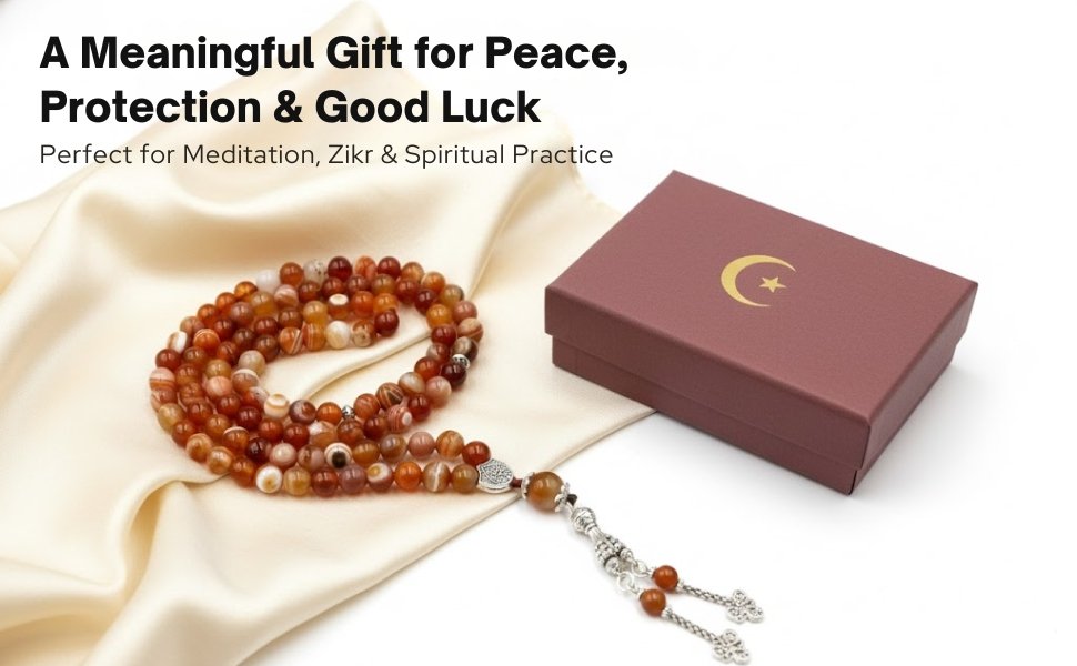 Red Agate Tasbih set on silk fabric beside its premium maroon crescent-and-star gift box