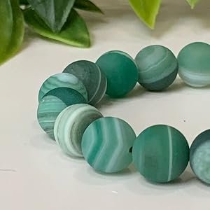 Polished Vibrant Green Agate Beads Showing Natural Banded Patterns